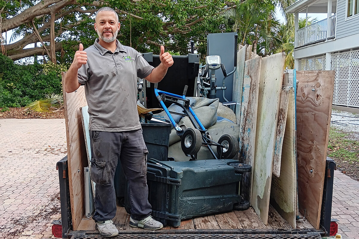 jose-after-putting-all-junk-in-truck Jose showing Thumbsup after Putting all junk in Trailer