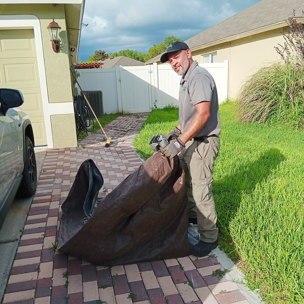jose-holding-bag-removing-debris Jose Holding Bag & Removing Debris