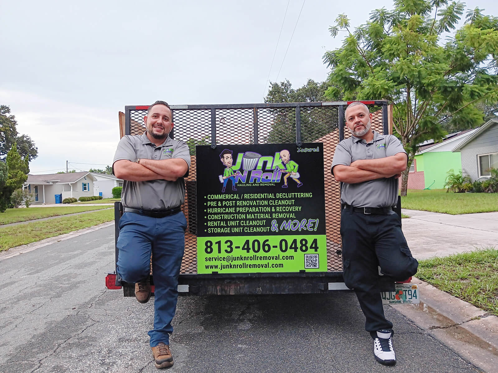 junk-n-roll-owners-standing Junk N Roll Removal Owners standing near the truck