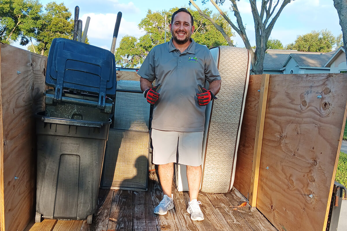 Ronel Smiling after putting all junks in trailer