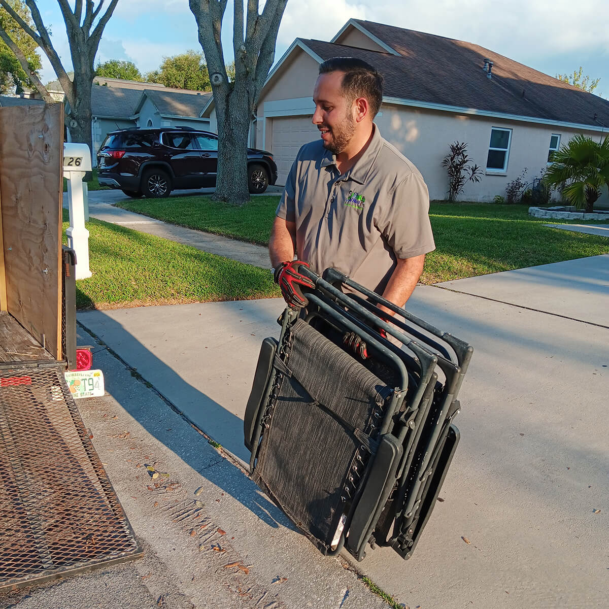 ronel-putting-folding-chair-in-truck Ronel Putting Folding Chair in Trailer