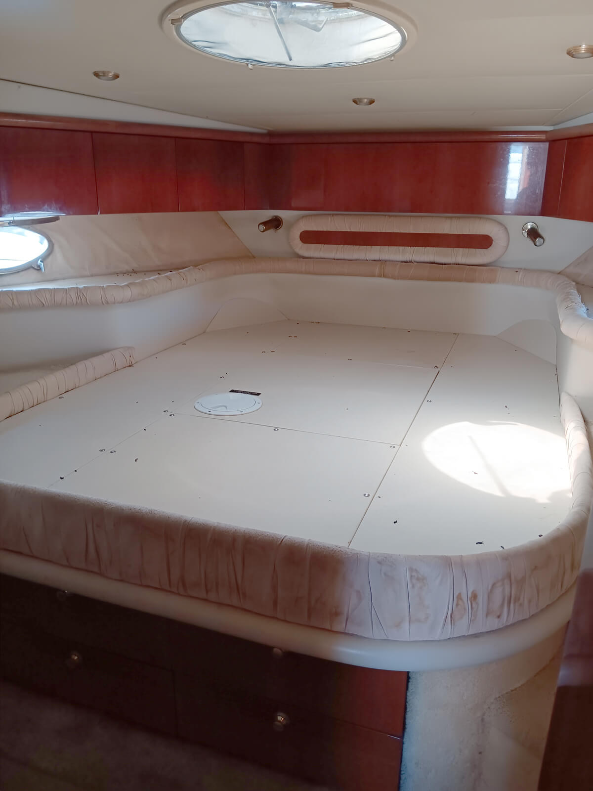 the inside of a boat with a bed in it