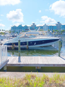 a boat docked at a dock in front of a building