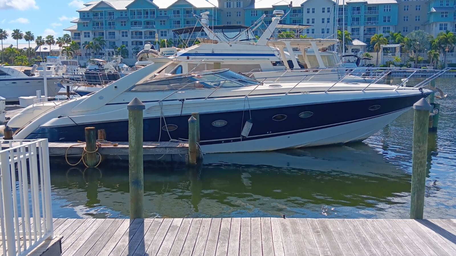 a boat is docked at a dock in a marina