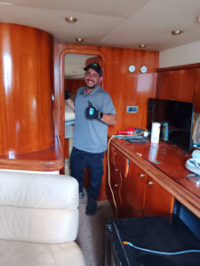 Ronel standing in the middle of a boat