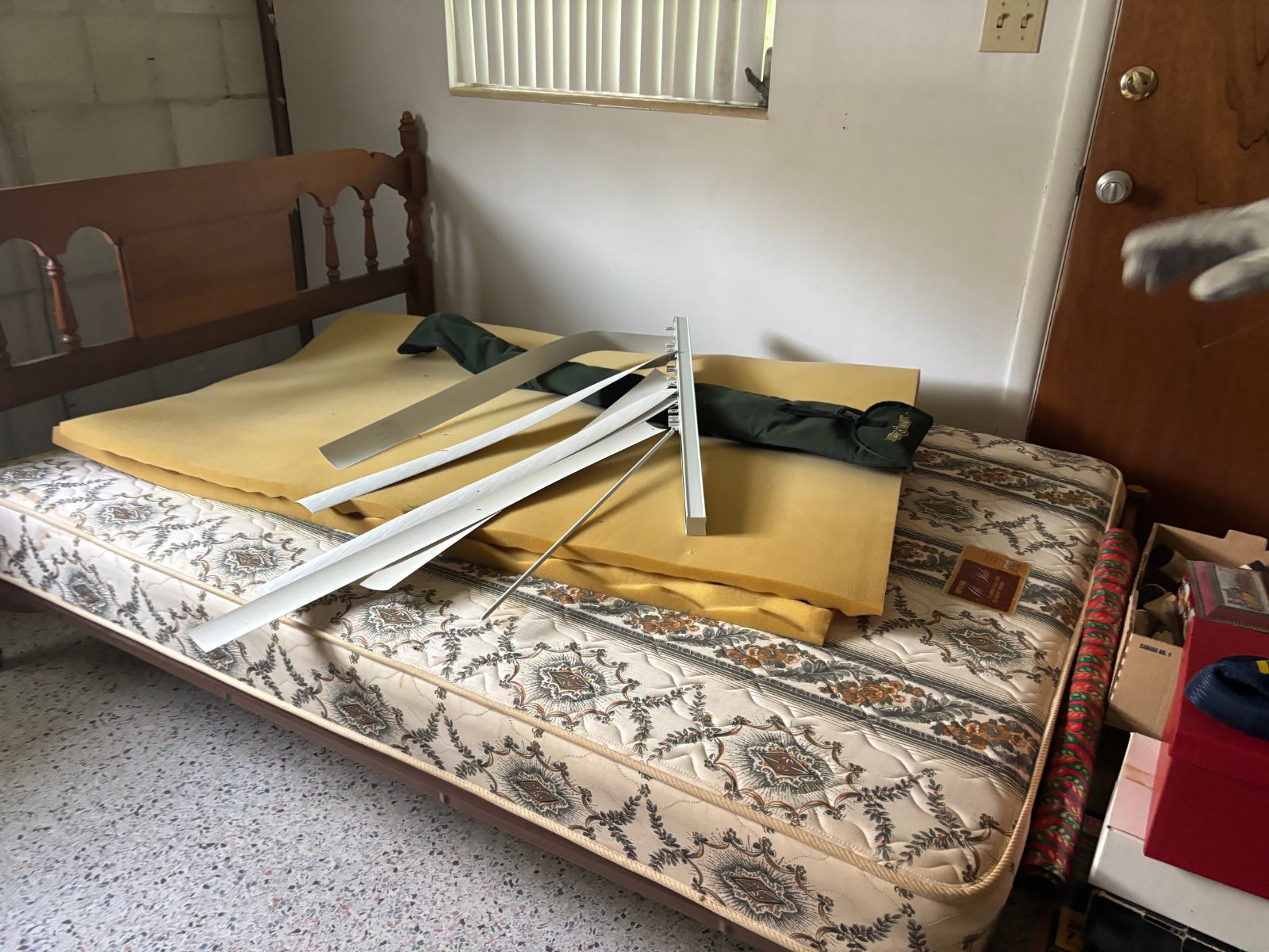 Bedroom mattress and clutter prepared for junk disposal