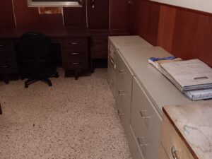 Metal file cabinets and desks awaiting junk hauling