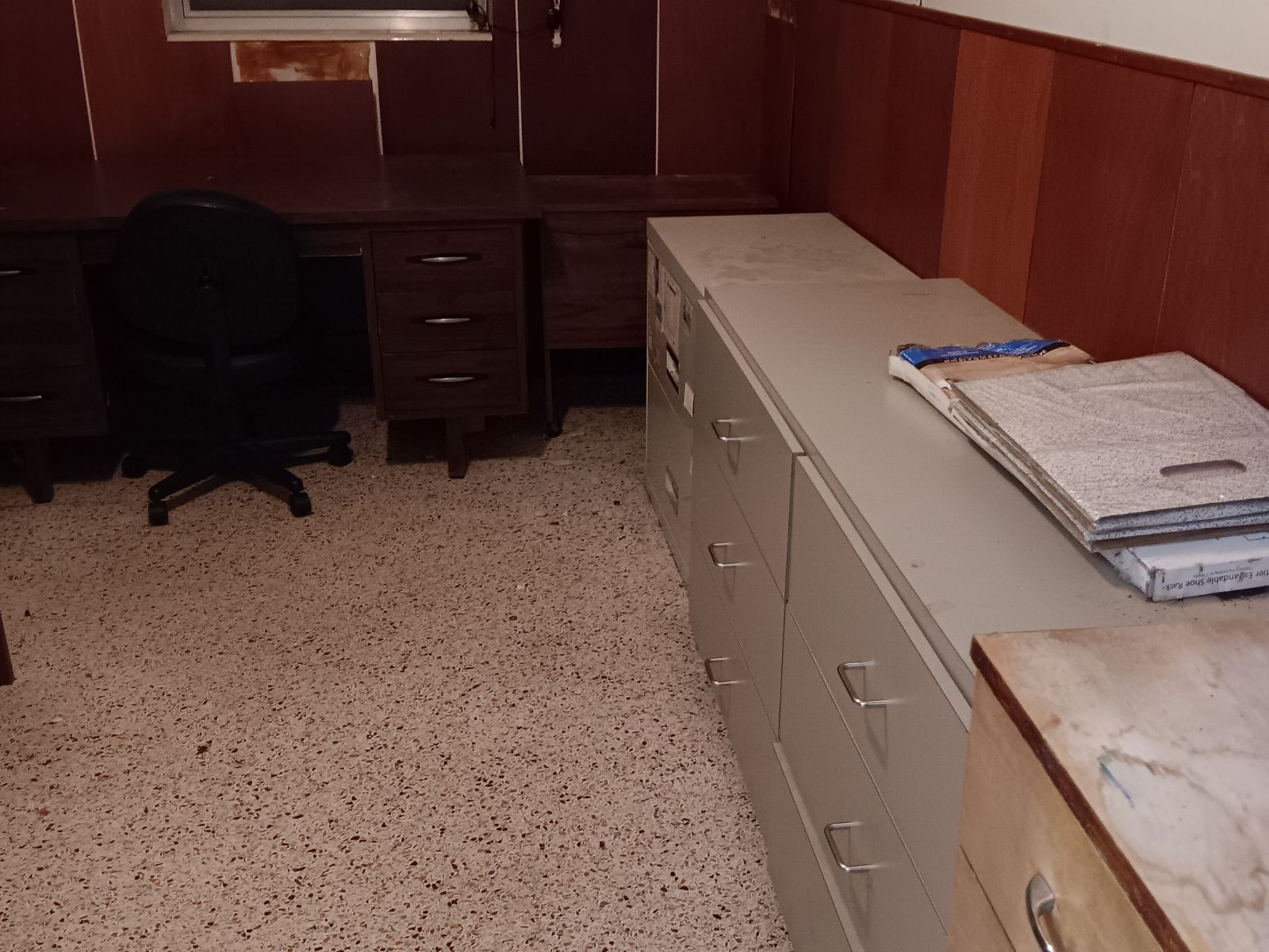 Metal file cabinets and desks awaiting junk hauling